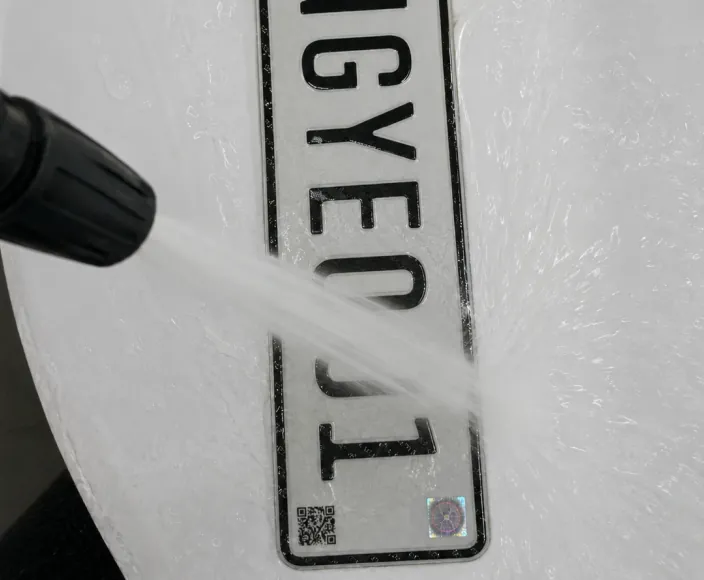 Water resistance inspection for anti-counterfeit mark