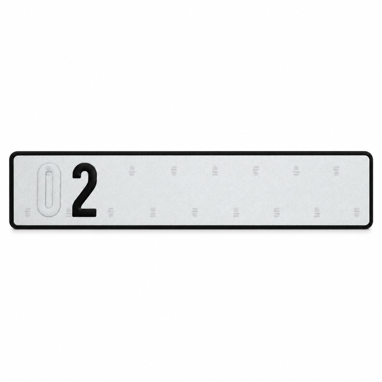 Reflective plate sample showing an unpeeled embossed character beside a black revealed character
